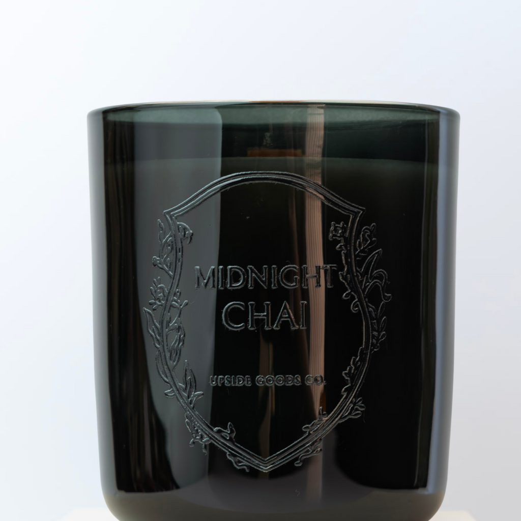 Black candle jar with 'Midnight Chai' branding on a white background - Upside Goods Co. Candle company 