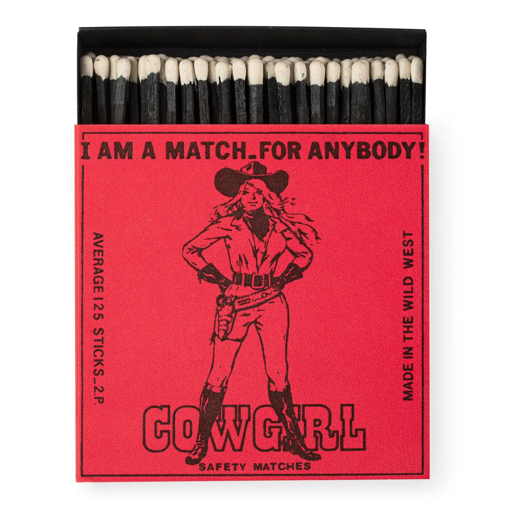 Matches with a red label featuring a cowgirl illustration and text.
