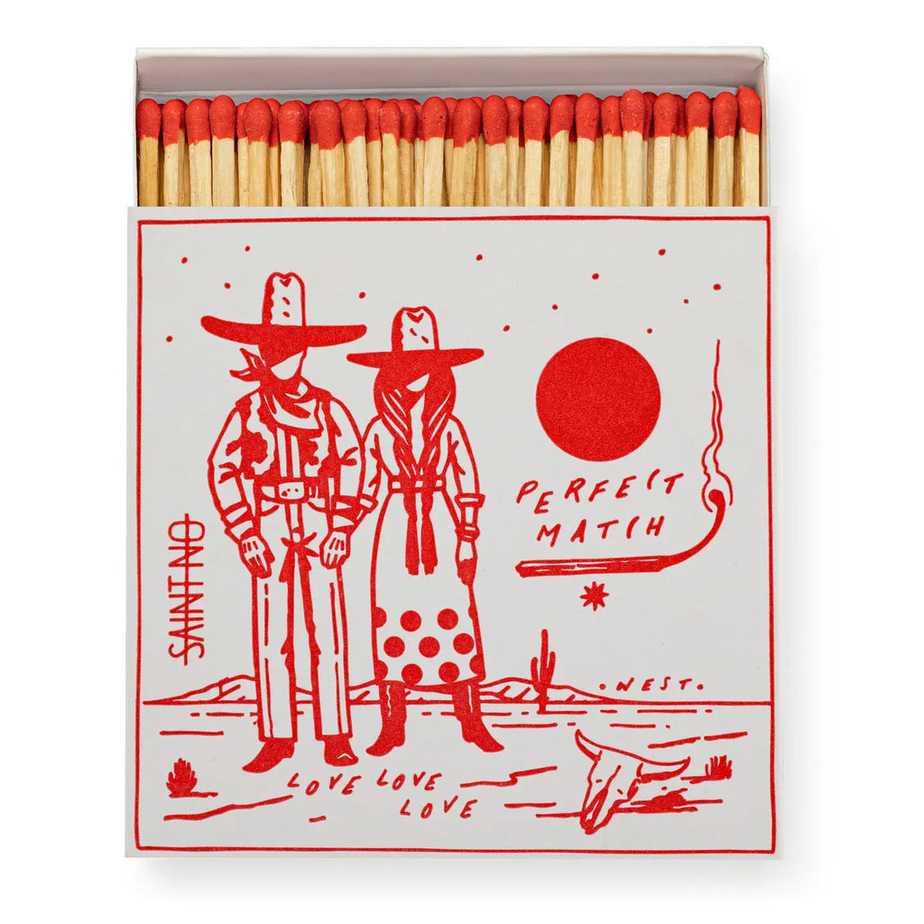 Matchbox with red and white design featuring two people in hats and the text 'Perfect Match'.