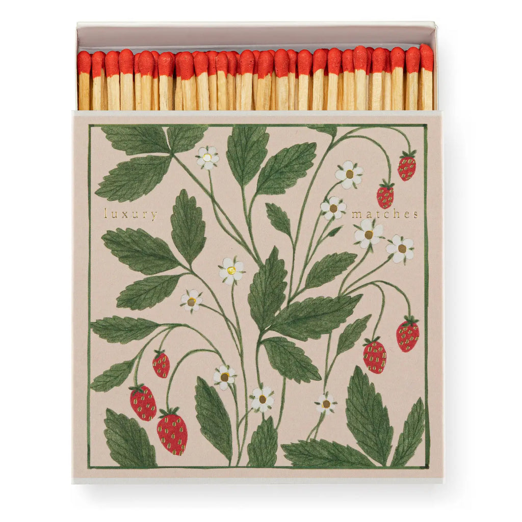 Matchbox with strawberry design and red matches