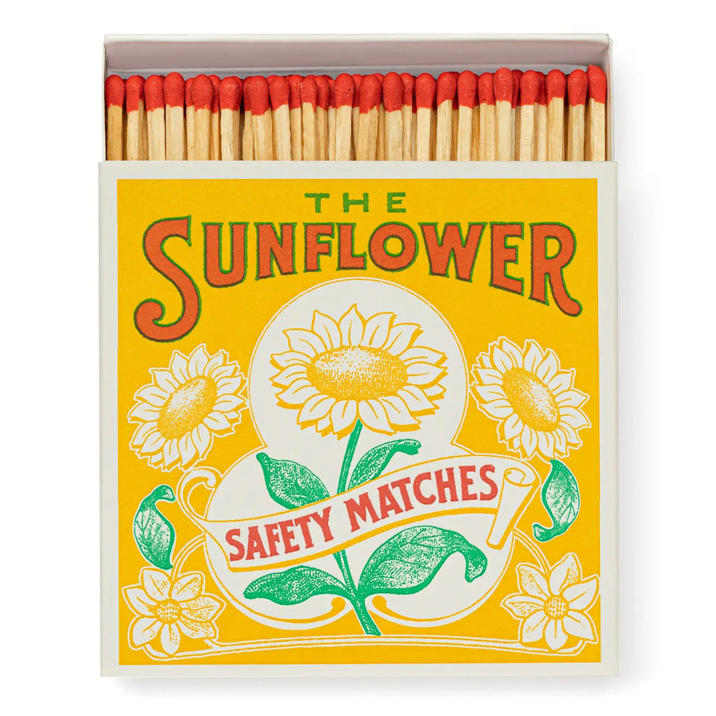 Matchbox labeled 'The Sunflower Safety Matches' with sunflower design on a yellow background